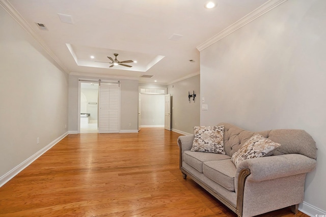 78 Oakmont Dr, Pawleys Island, SC 29585 - living area featuring a barn door, recessed lighting, crown molding, baseboards, and light wood-style floors