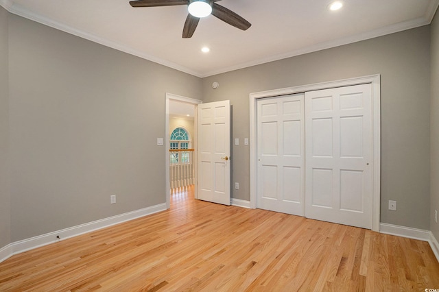 78 Oakmont Dr, Pawleys Island, SC 29585 - unfurnished bedroom featuring ornamental molding, light wood-style flooring, recessed lighting, baseboards, and a closet