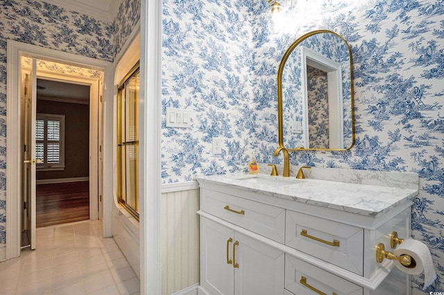 78 Oakmont Dr, Pawleys Island, SC 29585 - full bath featuring wallpapered walls, ornamental molding, vanity, tile patterned floors, and a shower with door