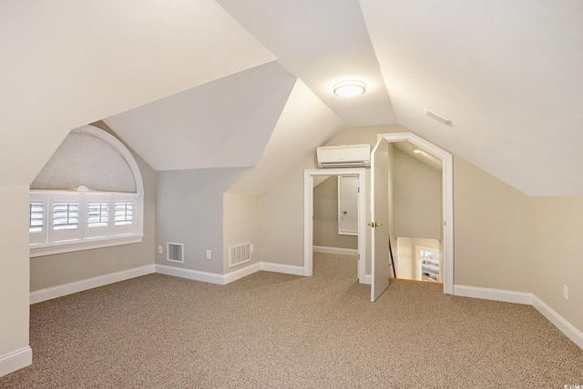 78 Oakmont Dr, Pawleys Island, SC 29585 - additional living space with a wall mounted AC, carpet flooring, lofted ceiling, and baseboards
