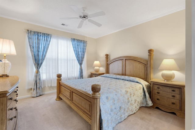 bedroom with light carpet, a ceiling fan, crown molding, and baseboards