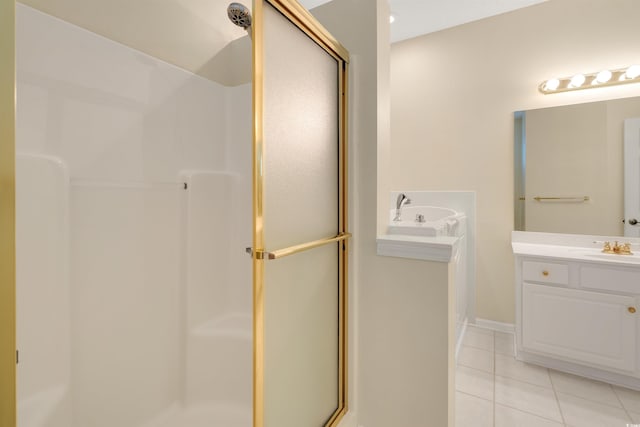 bathroom with tile patterned floors, a shower stall, and vanity