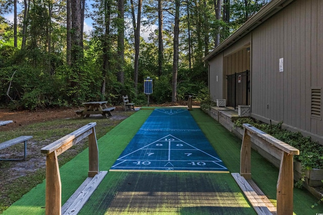 view of home's community featuring shuffleboard