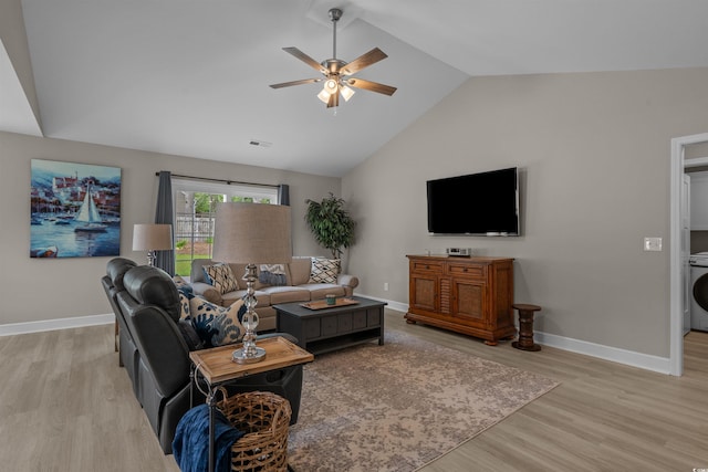 1307 Collins Park St, Conway, SC 29526 - living room featuring a ceiling fan, light wood-style flooring, baseboards, washer / clothes dryer, and high vaulted ceiling