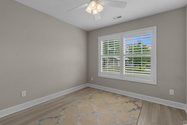 1307 Collins Park St, Conway, SC 29526 - spare room with wood finished floors, baseboards, and a ceiling fan