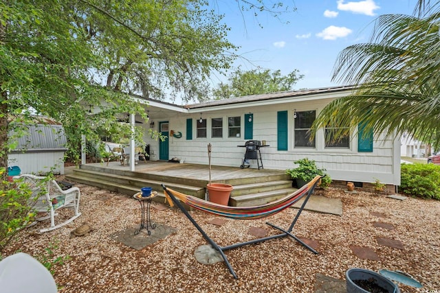 back of property with a deck