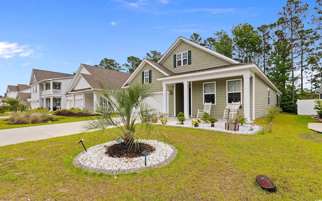 736 Flowering Branch Ave, Little River, SC 29566 - view of front facade featuring a porch and a front yard
