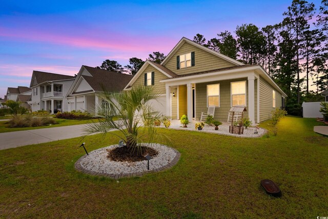 736 Flowering Branch Ave, Little River, SC 29566 - view of front of home with a lawn, driveway, and a porch
