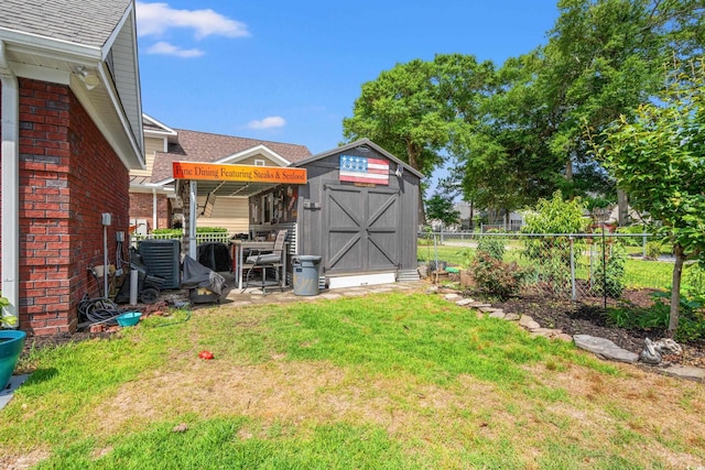 view of yard with a storage unit and an outdoor structure