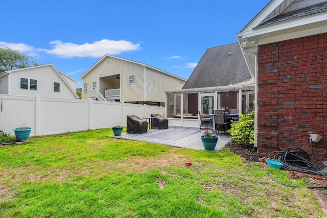 2019 Ye Olde Kings Hwy, North Myrtle Beach, SC 29582 - view of yard with a patio area and a sunroom