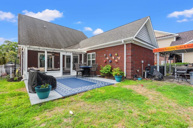 2019 Ye Olde Kings Hwy, North Myrtle Beach, SC 29582 - rear view of house featuring a patio, roof with shingles, brick siding, and a ceiling fan