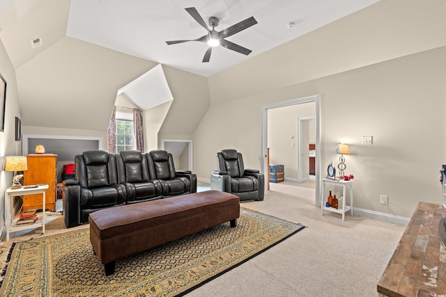 home theater featuring vaulted ceiling, carpet flooring, ceiling fan, and baseboards