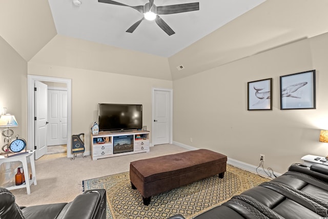 living area with ceiling fan, carpet, vaulted ceiling, and baseboards