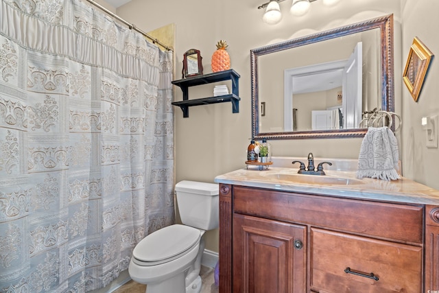 full bathroom with toilet and vanity