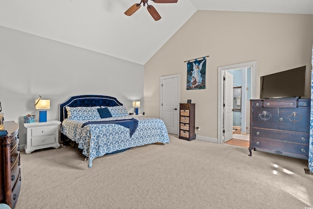 bedroom with carpet floors, high vaulted ceiling, baseboards, ceiling fan, and connected bathroom