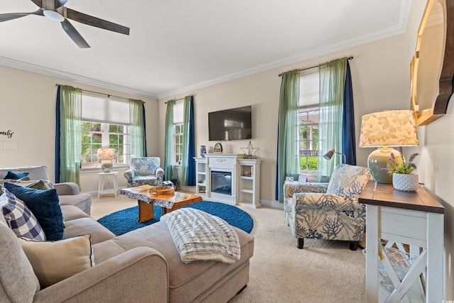 2019 Ye Olde Kings Hwy, North Myrtle Beach, SC 29582 - carpeted living area featuring ornamental molding, a ceiling fan, baseboards, and a glass covered fireplace