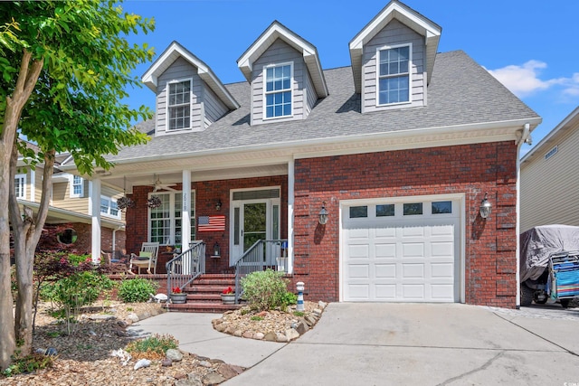 2019 Ye Olde Kings Hwy, North Myrtle Beach, SC 29582 - cape cod house featuring brick siding, roof with shingles, concrete driveway, and covered porch