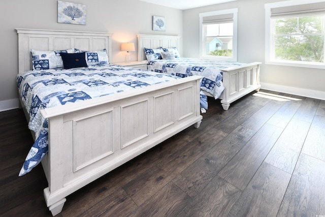 113B 11th Ave S, Surfside Beach, SC 29575 - bedroom with dark wood finished floors and baseboards