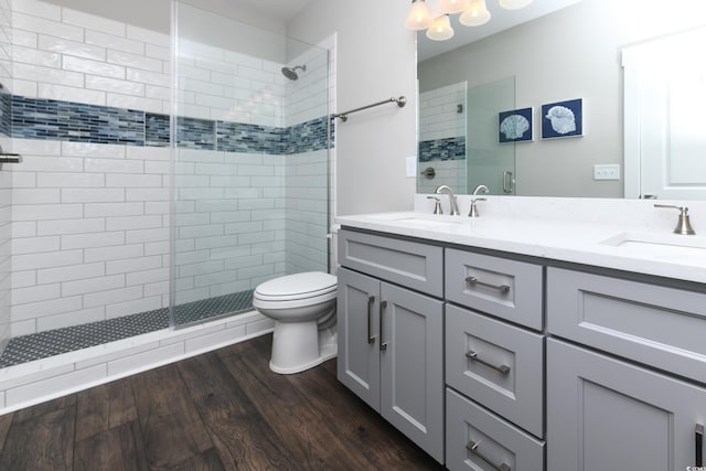 113B 11th Ave S, Surfside Beach, SC 29575 - full bath featuring tiled shower, double vanity, and wood finished floors