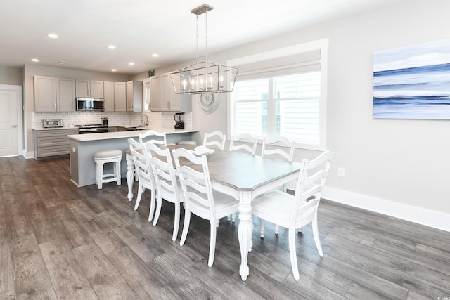 113B 11th Ave S, Surfside Beach, SC 29575 - dining room featuring a chandelier, dark wood-type flooring, and recessed lighting