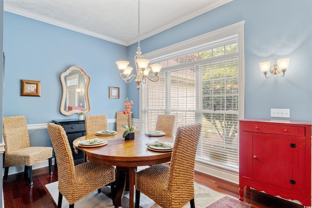 dining area with a chandelier, wood finished floors, ornamental molding, and baseboards