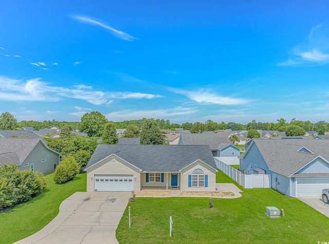 view of front of house with an attached garage, concrete driveway, and a residential view