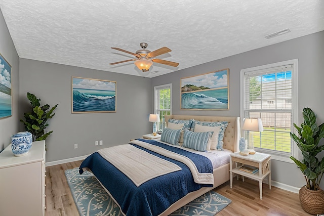 125 Balsa Dr, Longs, SC 29568 - bedroom with wood finished floors, a textured ceiling, and a ceiling fan