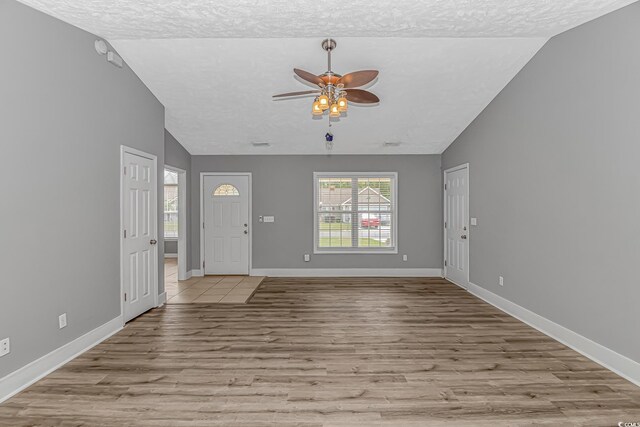 125 Balsa Dr, Longs, SC 29568 - foyer entrance with a ceiling fan, a textured ceiling, lofted ceiling, and wood finished floors