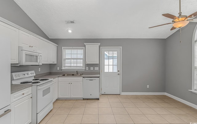 125 Balsa Dr, Longs, SC 29568 - kitchen featuring white appliances, ceiling fan, white cabinets, light countertops, and vaulted ceiling