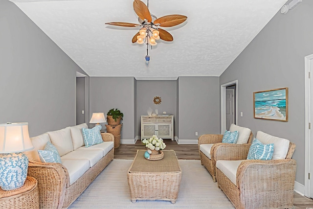 125 Balsa Dr, Longs, SC 29568 - living room with lofted ceiling, ceiling fan, light wood-style floors, and a textured ceiling