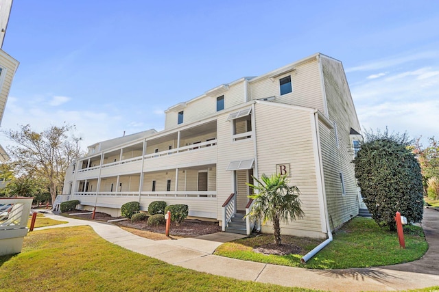 1100 Possum Trot Rd Unit B202, North Myrtle Beach, SC 29582 - view of building exterior featuring entry steps
