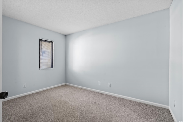 1100 Possum Trot Rd Unit B202, North Myrtle Beach, SC 29582 - carpeted empty room featuring baseboards and a textured ceiling