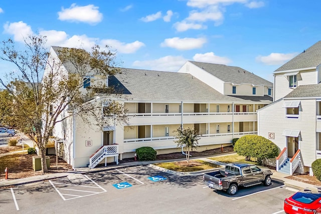 1100 Possum Trot Rd Unit B202, North Myrtle Beach, SC 29582 - view of property featuring uncovered parking