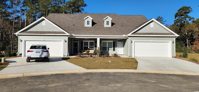 TBD Aft Ct Unit 101, Murrells Inlet, SC 29576 - view of front of property with a garage, concrete driveway, roof with shingles, and a front lawn