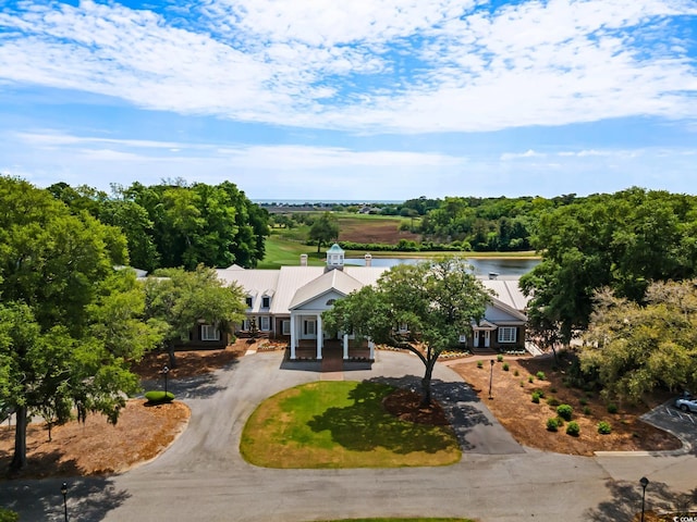 view of subject property with a nearby body of water