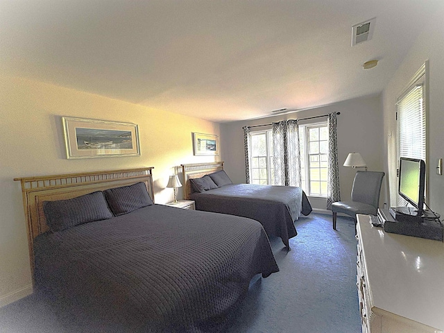 carpeted bedroom with baseboards