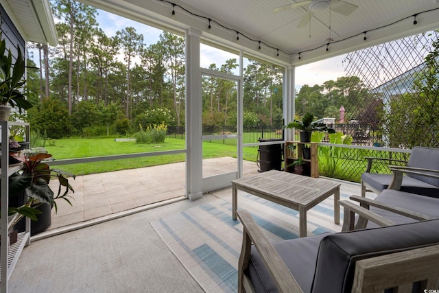 306 Southgate Ct, Pawleys Island, SC 29585 - sunroom featuring ceiling fan, outdoor lounge area, and view of wooded area