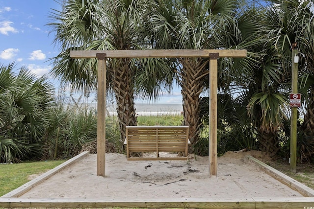 view of patio / terrace with view of water and beach