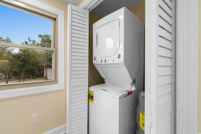 washroom with estacked washer and dryer