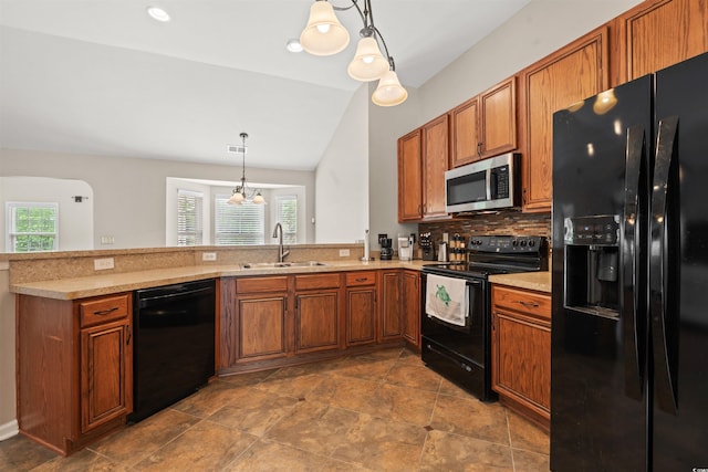 3 Birdsong Ct, Murrells Inlet, SC 29576 - kitchen featuring black appliances, a sink, brown cabinetry, a peninsula, and healthy amount of natural light