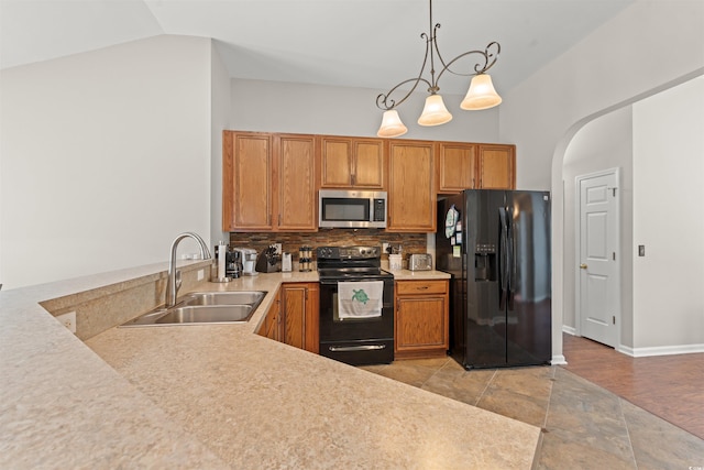 3 Birdsong Ct, Murrells Inlet, SC 29576 - kitchen featuring black appliances, a sink, light countertops, backsplash, and arched walkways