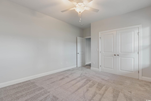 61 Yale Pl, Pawleys Island, SC 29585 - unfurnished bedroom with carpet floors, baseboards, a closet, and a ceiling fan
