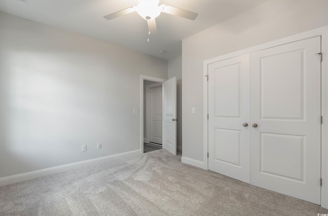61 Yale Pl, Pawleys Island, SC 29585 - unfurnished bedroom with carpet flooring, a closet, baseboards, and a ceiling fan