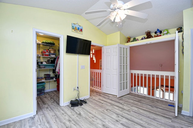 990 Palisade Cir, Myrtle Beach, SC 29577 - unfurnished bedroom featuring wood finished floors, vaulted ceiling, a spacious closet, a closet, and baseboards