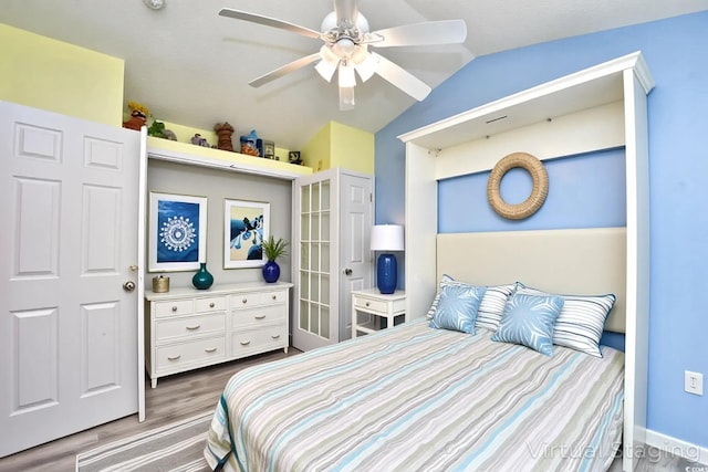 990 Palisade Cir, Myrtle Beach, SC 29577 - bedroom with wood finished floors, vaulted ceiling, and ceiling fan