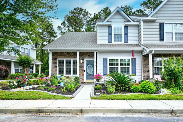 990 Palisade Cir, Myrtle Beach, SC 29577 - view of front of house with brick siding and roof with shingles