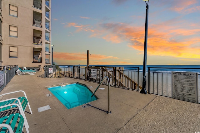 1690 N Waccamaw Dr Unit 103, Garden City Beach, SC 29576 - view of swimming pool with a water view