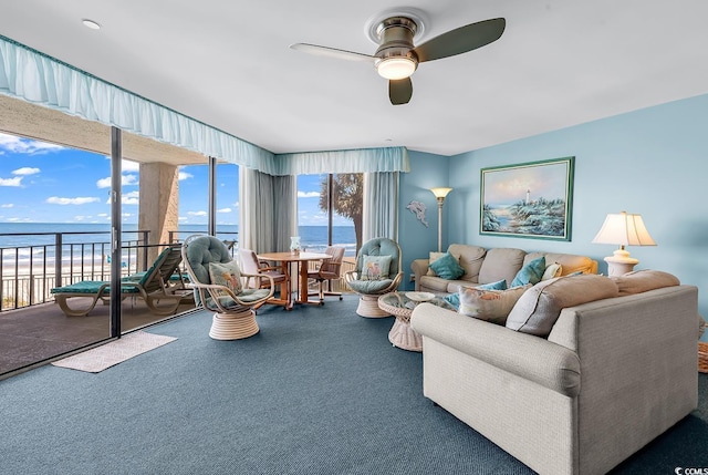 1690 N Waccamaw Dr Unit 103, Garden City Beach, SC 29576 - living area featuring a ceiling fan, a water view, and carpet floors