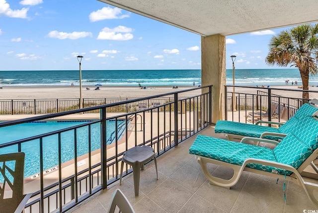 1690 N Waccamaw Dr Unit 103, Garden City Beach, SC 29576 - balcony with view of water and beach