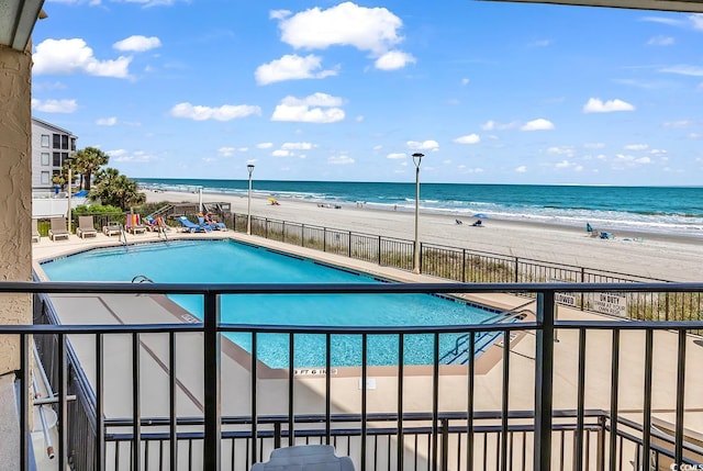 1690 N Waccamaw Dr Unit 103, Garden City Beach, SC 29576 - community pool featuring view of water and beach and fence